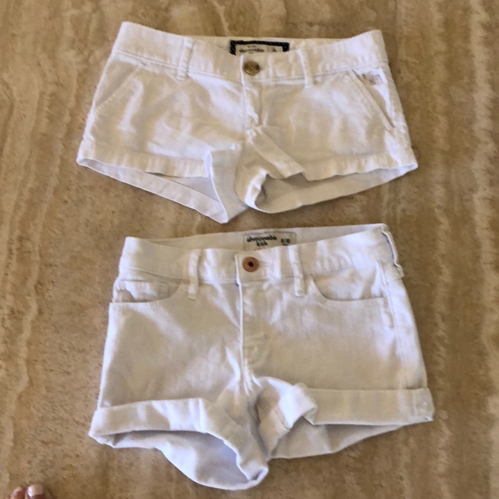 Two pairs of white Abercrombie kids shorts
